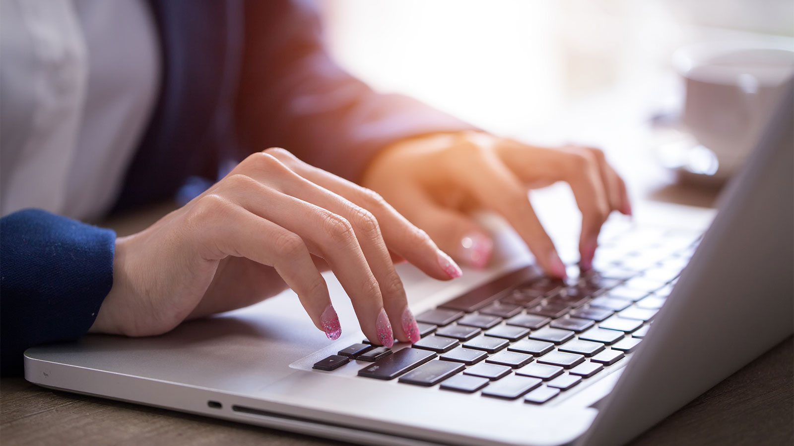 Person typing on a laptop computer