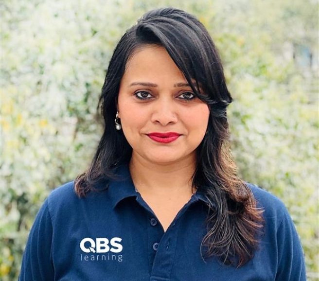 Madhu: Headshot of a smiling woman